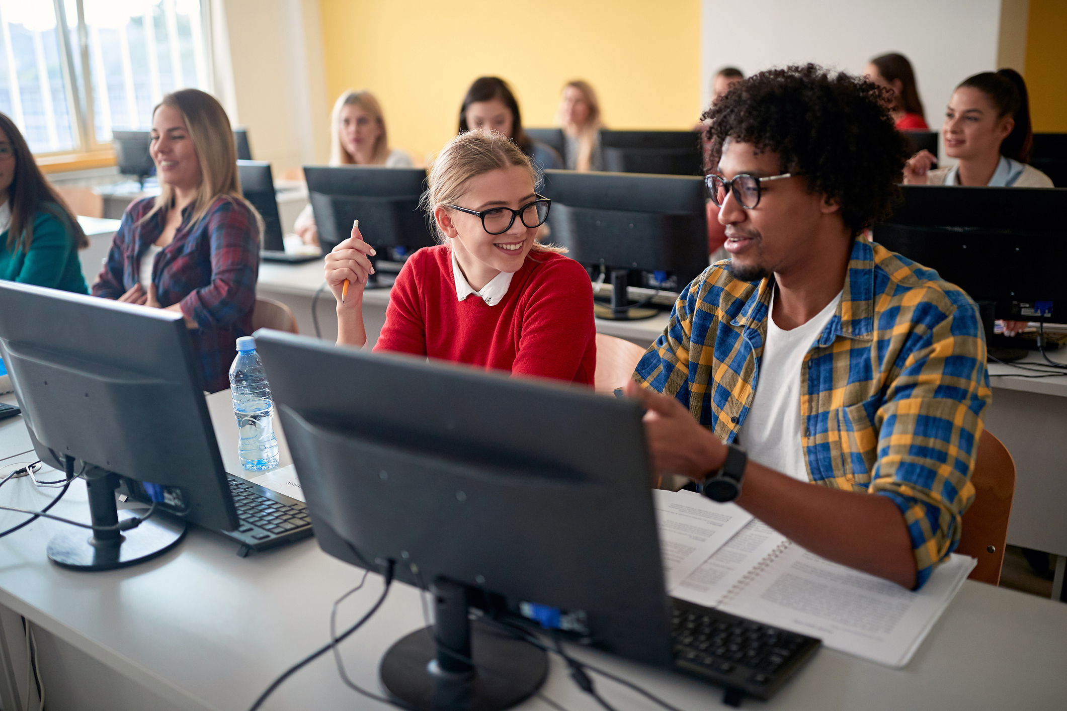 Students at an informatics lecture in the university computer classroom